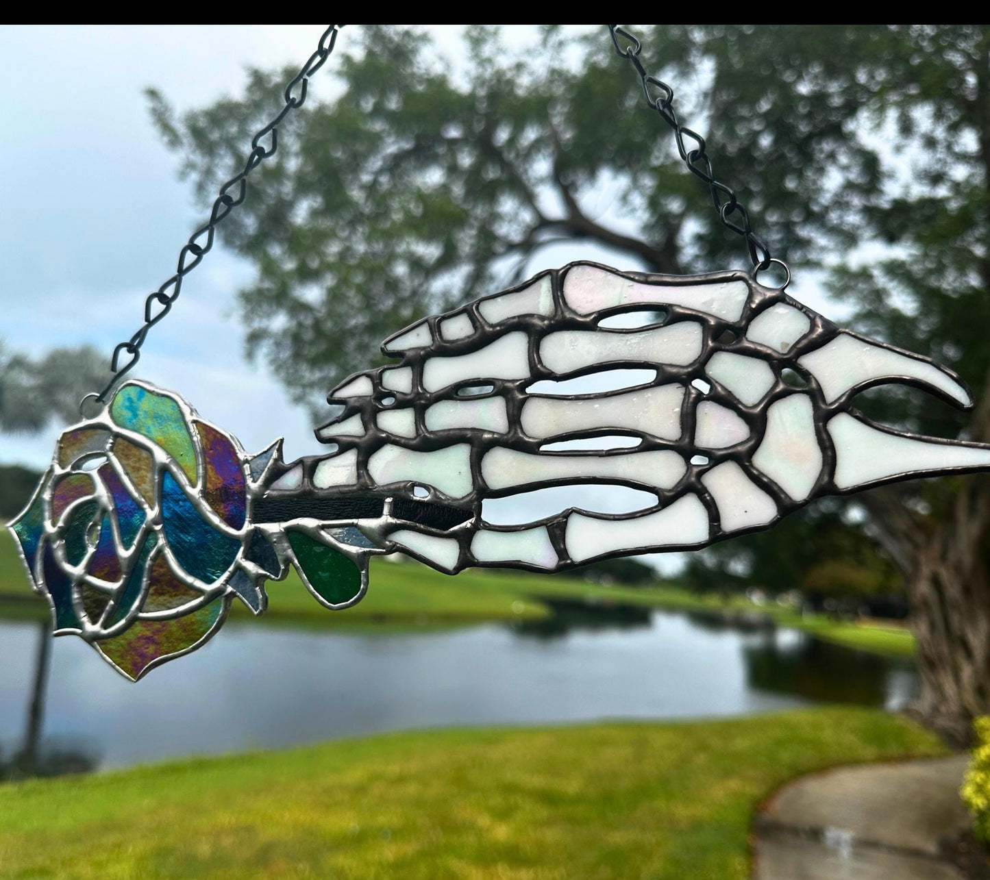Stained Glass Skeleton Hand with Iridescent Rose – Gothic Window Suncatcher, Handmade Wall Hanging Art