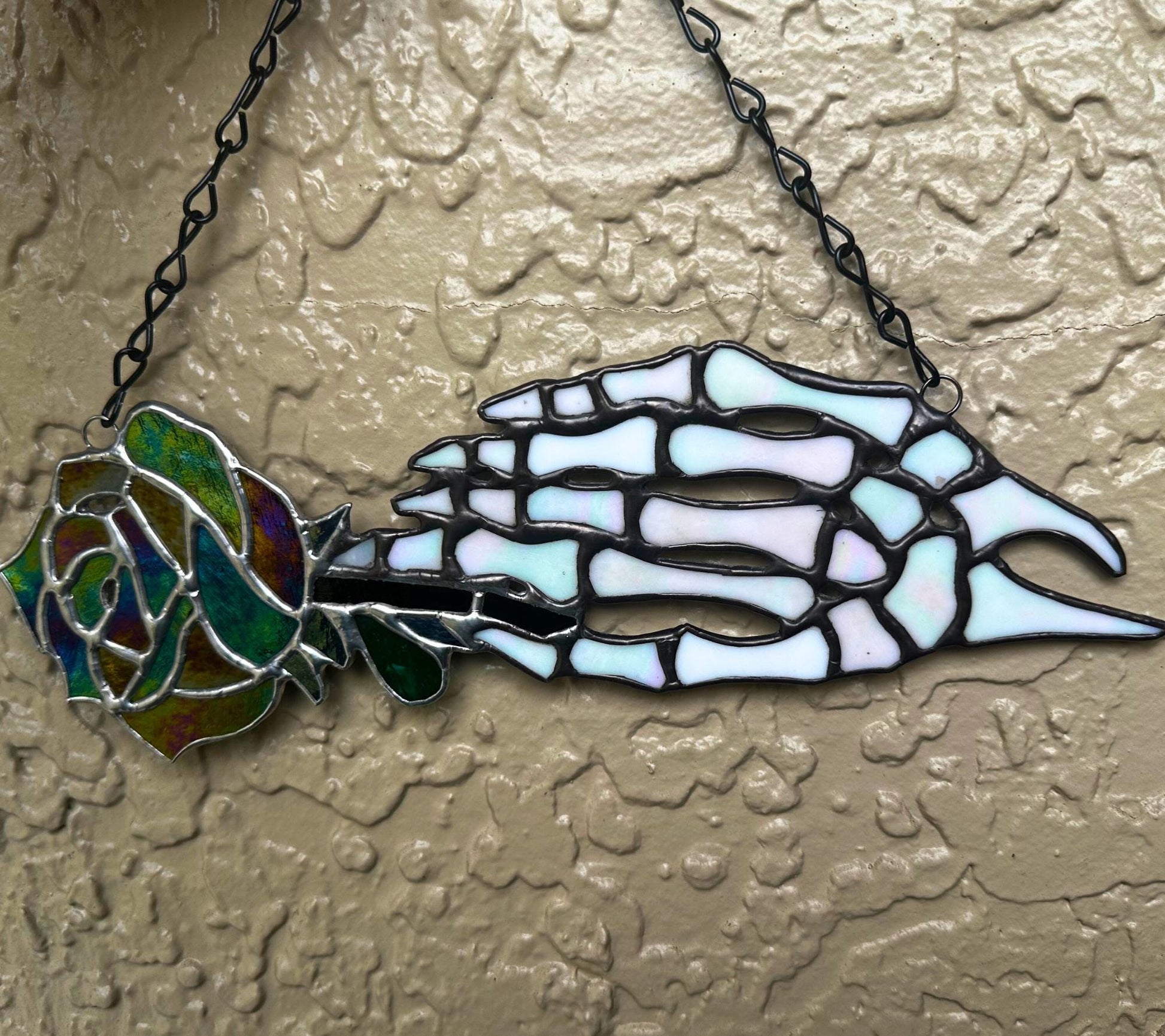 Stained Glass Skeleton Hand with Iridescent Rose – Gothic Window Suncatcher, Handmade Wall Hanging Art