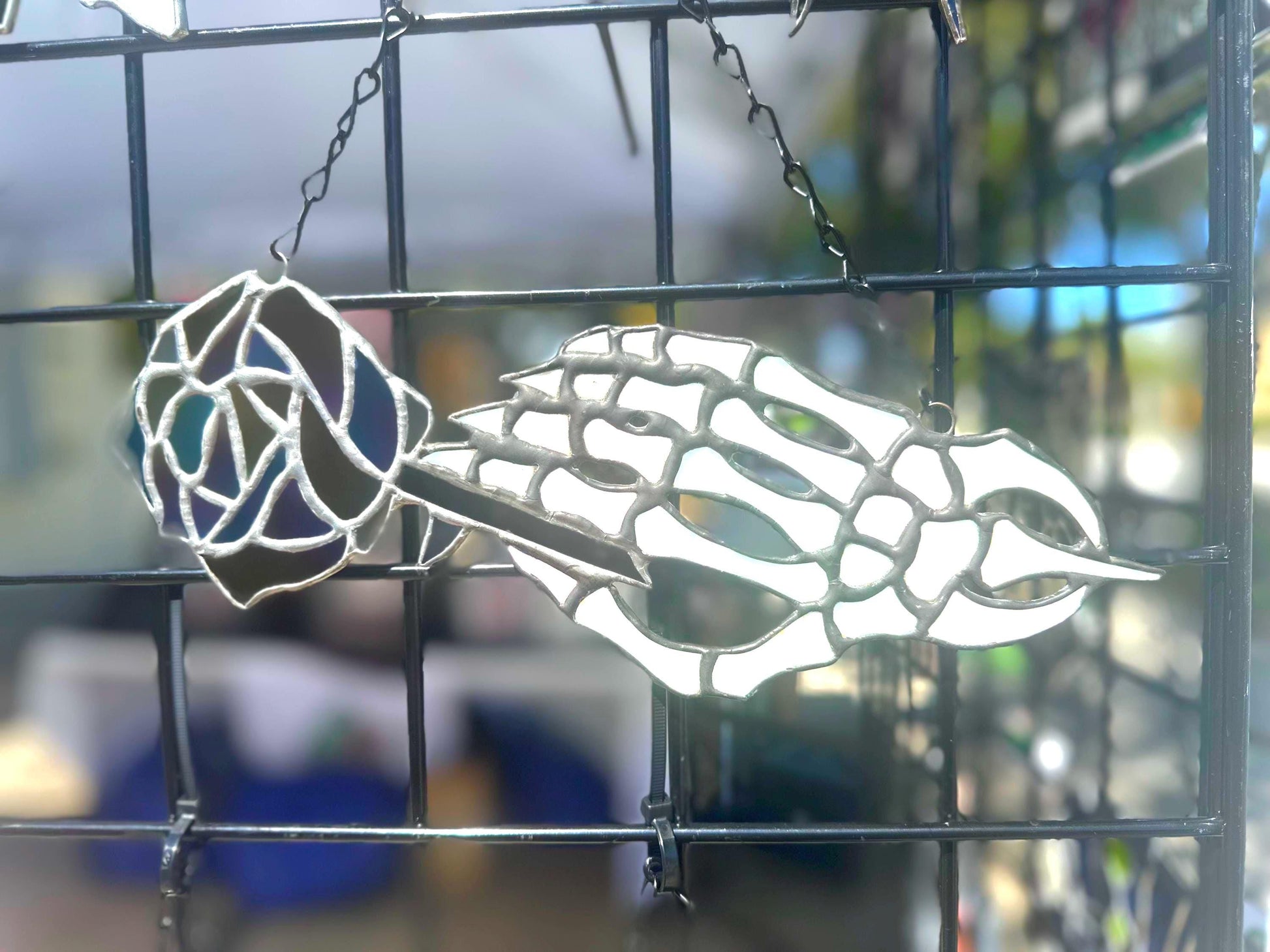 Stained Glass Skeleton Hand with Iridescent Rose – Gothic Window Suncatcher, Handmade Wall Hanging Art