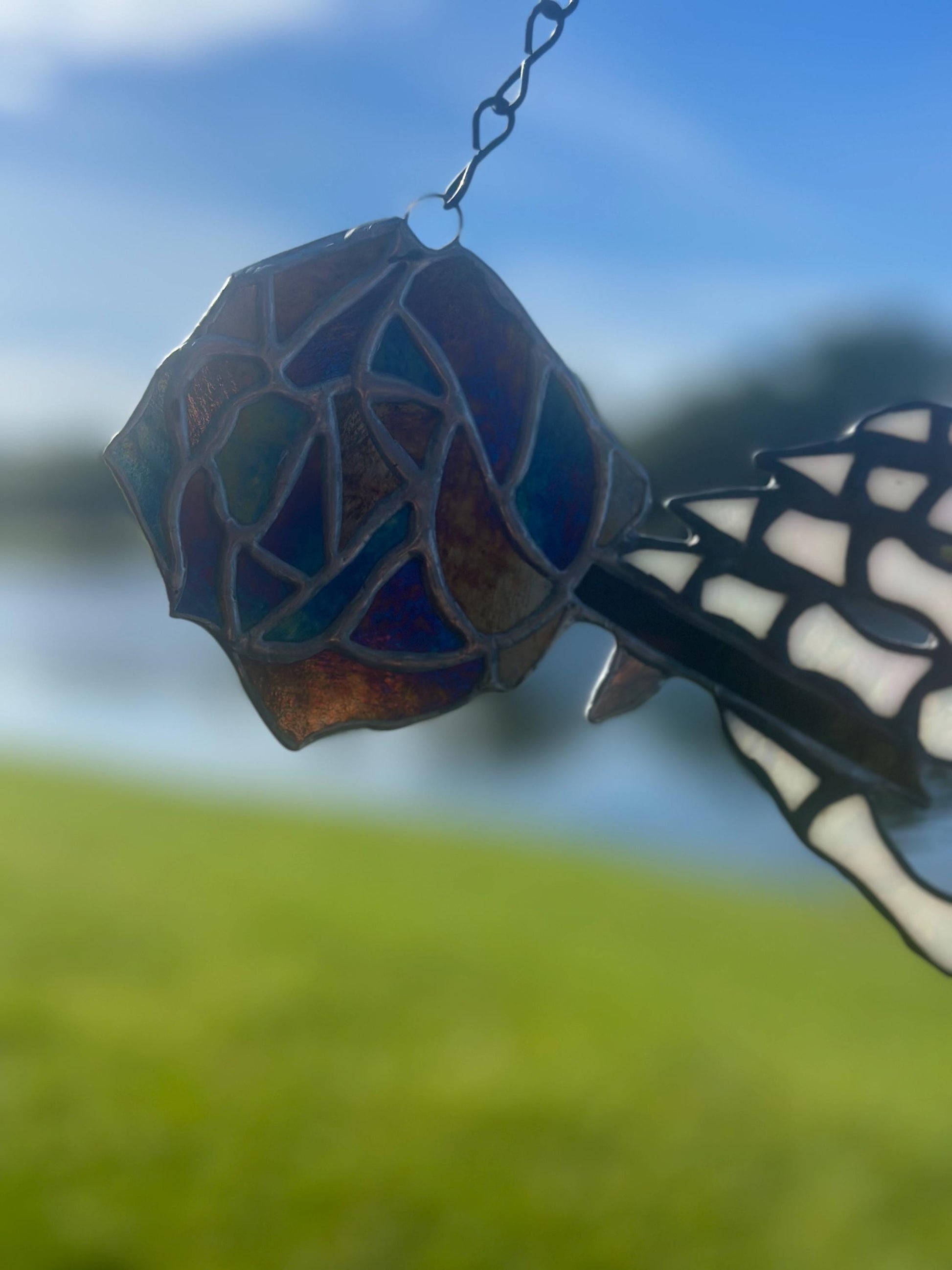 Stained Glass Skeleton Hand with Iridescent Rose – Gothic Window Suncatcher, Handmade Wall Hanging Art
