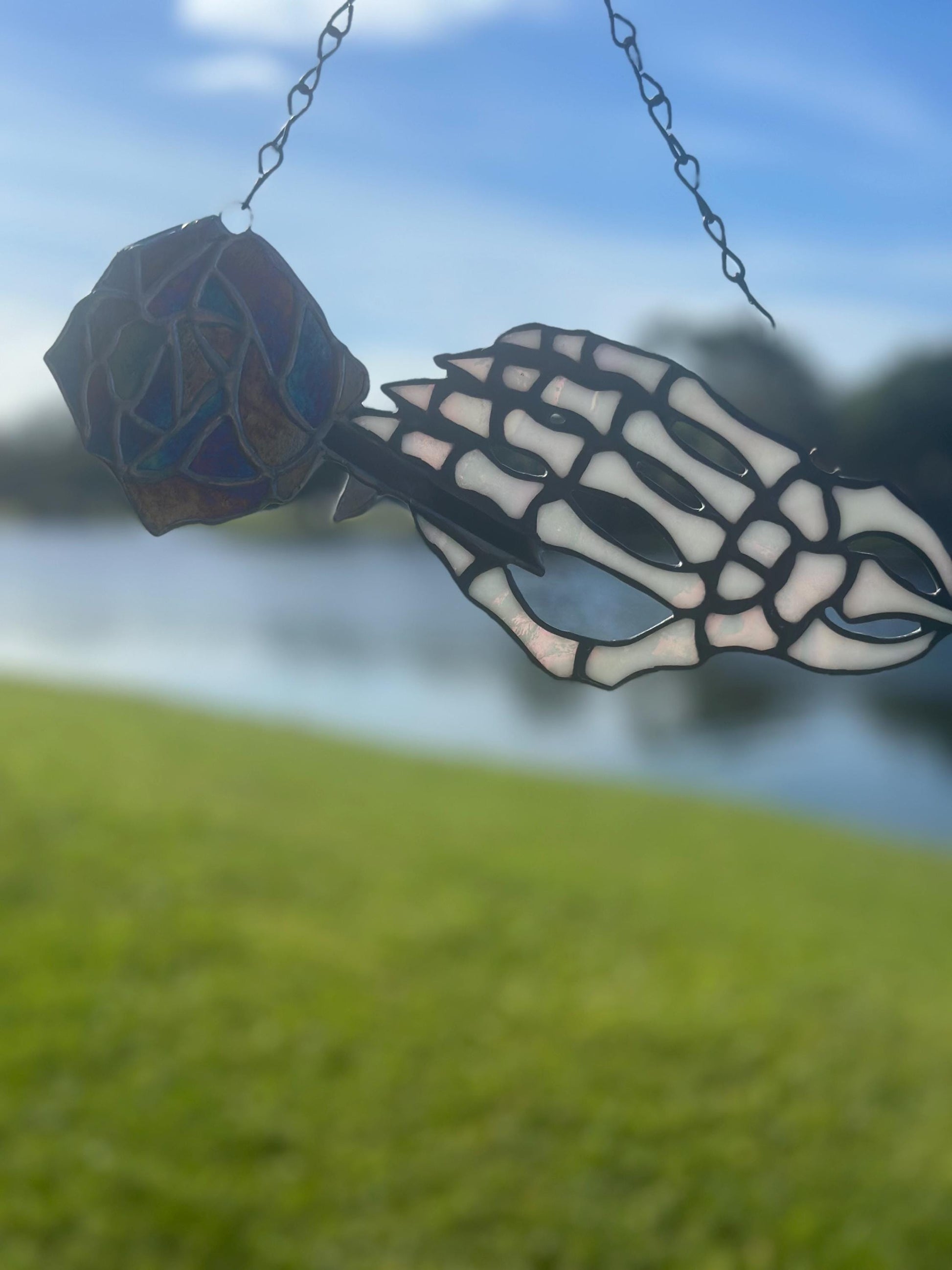 Stained Glass Skeleton Hand with Iridescent Rose – Gothic Window Suncatcher, Handmade Wall Hanging Art