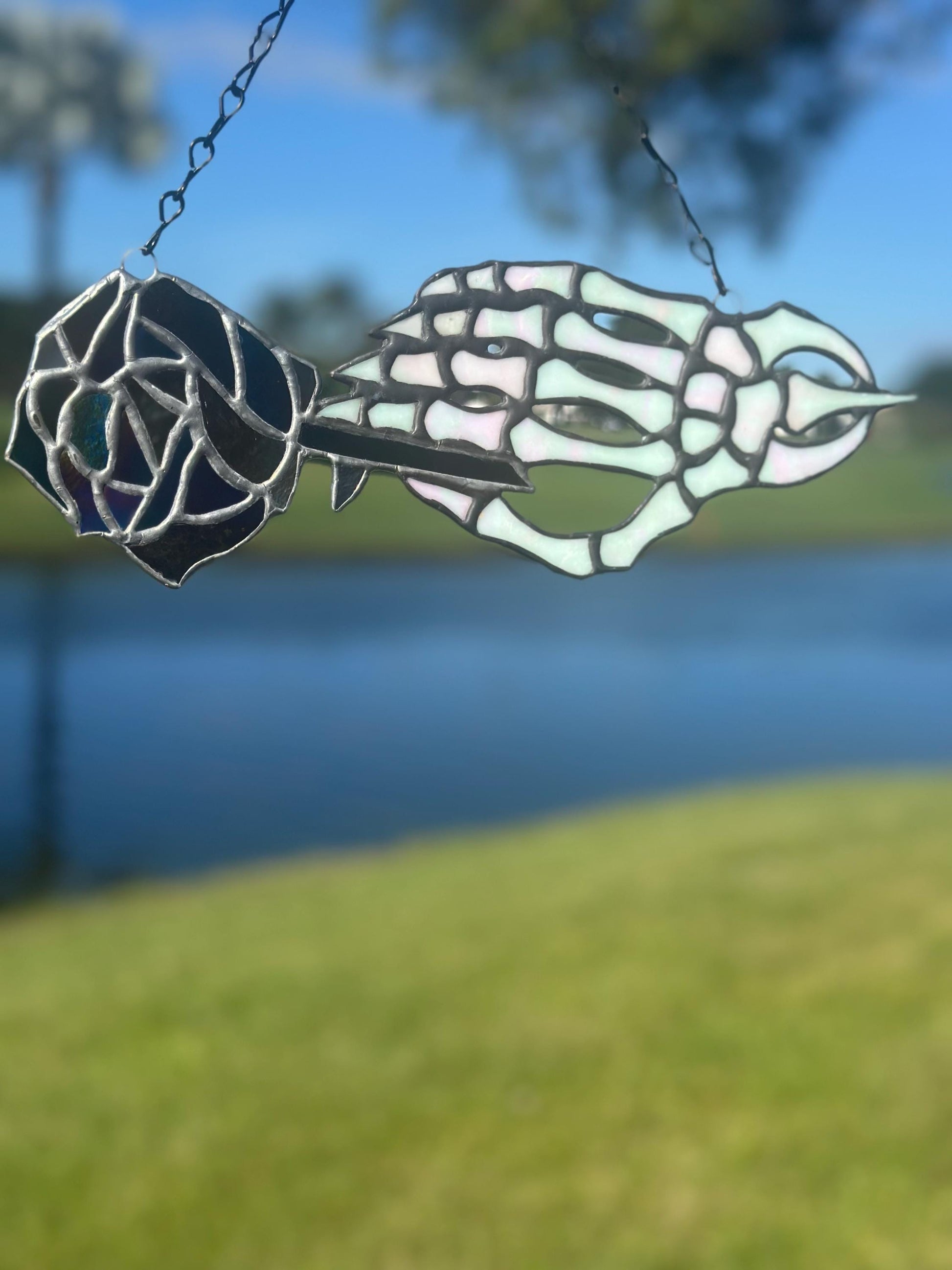 Stained Glass Skeleton Hand with Iridescent Rose – Gothic Window Suncatcher, Handmade Wall Hanging Art