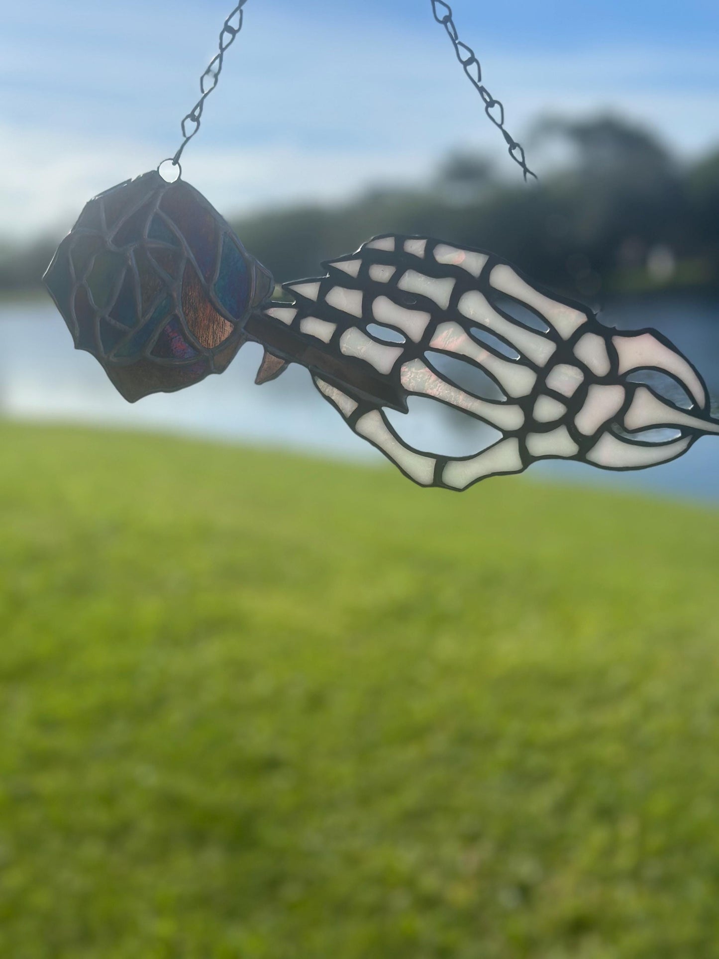 Stained Glass Skeleton Hand with Iridescent Rose – Gothic Window Suncatcher, Handmade Wall Hanging Art