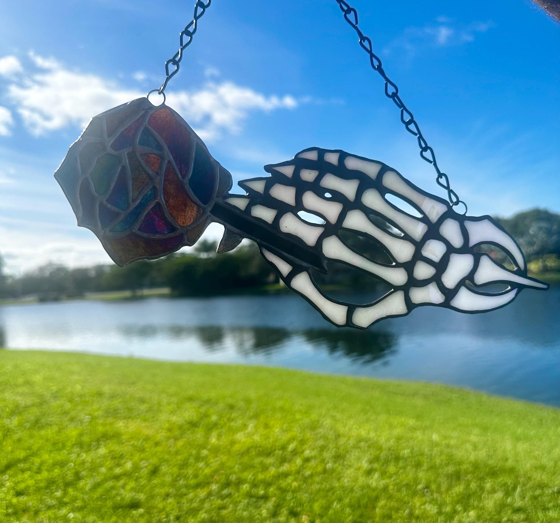 Stained Glass Skeleton Hand with Iridescent Rose – Gothic Window Suncatcher, Handmade Wall Hanging Art