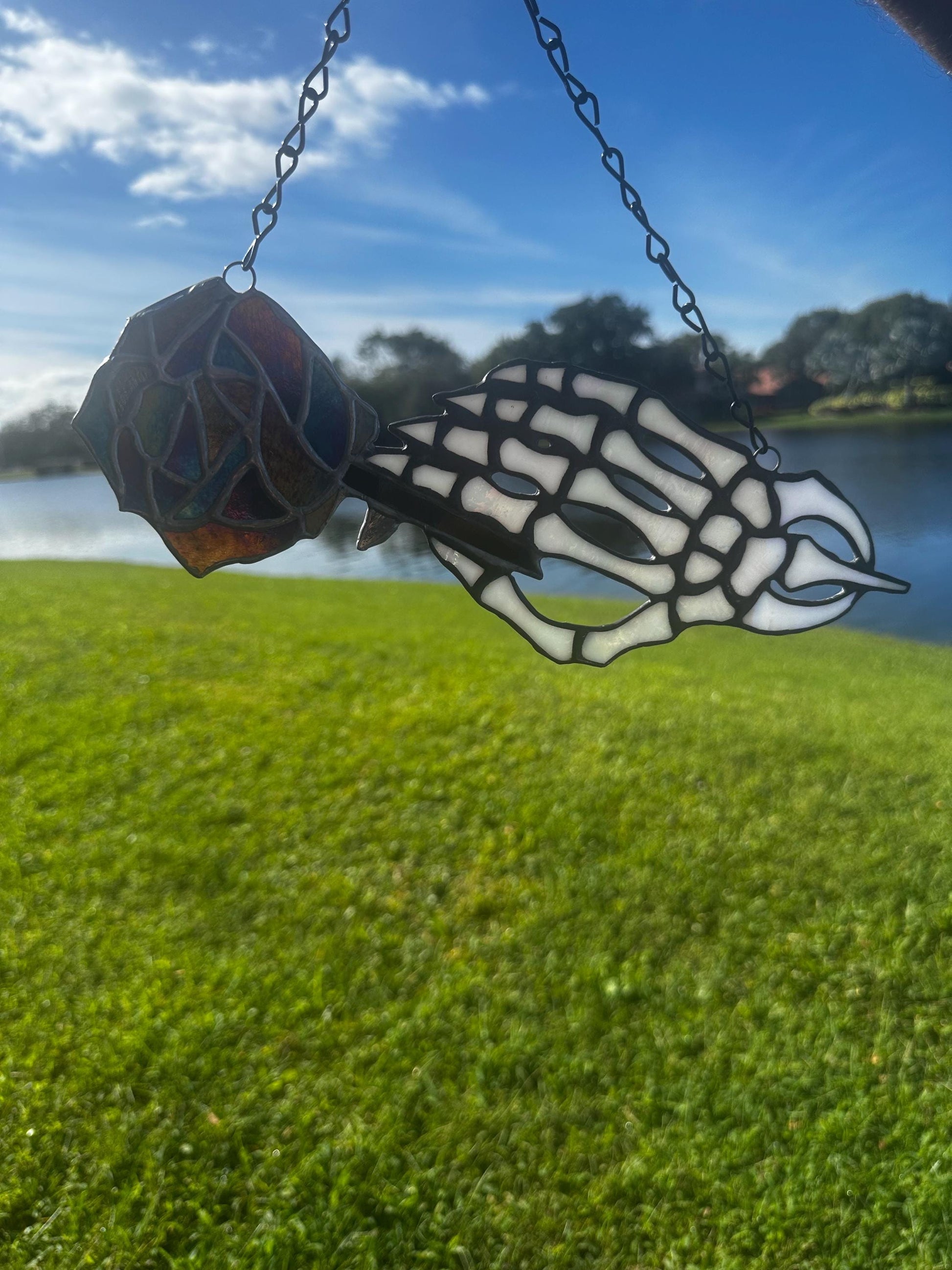 Stained Glass Skeleton Hand with Iridescent Rose – Gothic Window Suncatcher, Handmade Wall Hanging Art