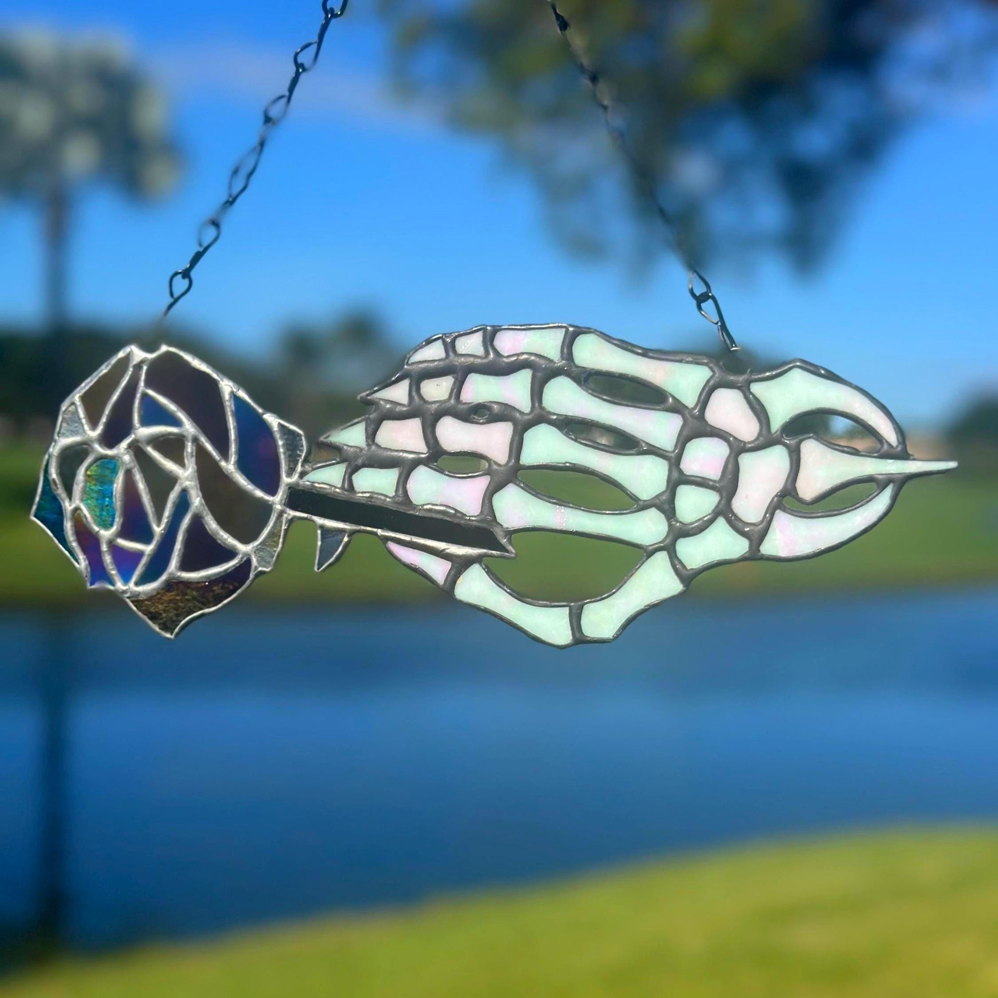Stained Glass Skeleton Hand with Iridescent Rose – Gothic Window Suncatcher, Handmade Wall Hanging Art
